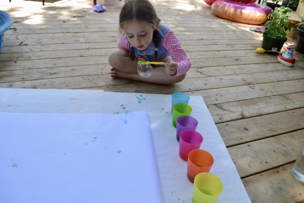 Girl doing bubble painting